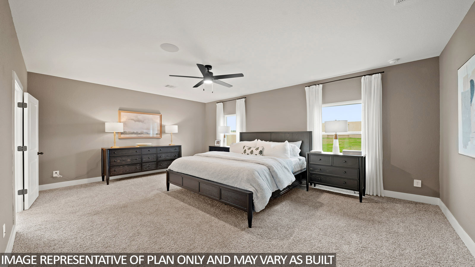 Primary bedroom with carpet flooring and window in Hockley, TX