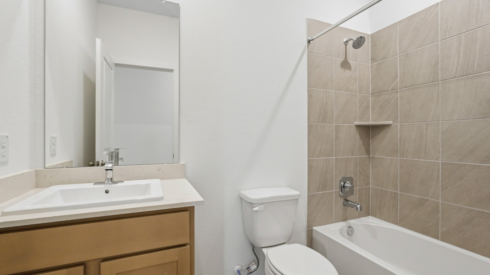 secondary bathroom with tub and shower combo