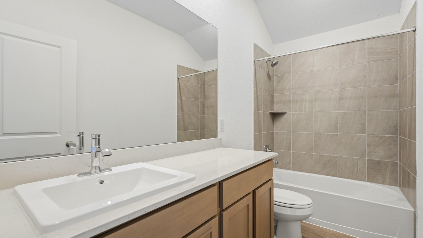 secondary bathroom with tub and shower combo