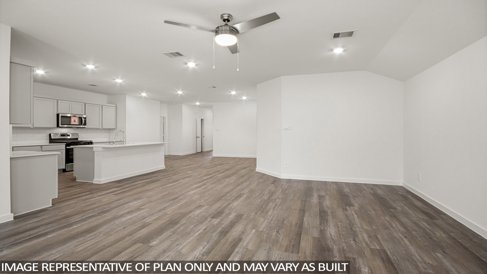 open concept livivng and dining area with vinyl flooring, quartz countertops, and large windows