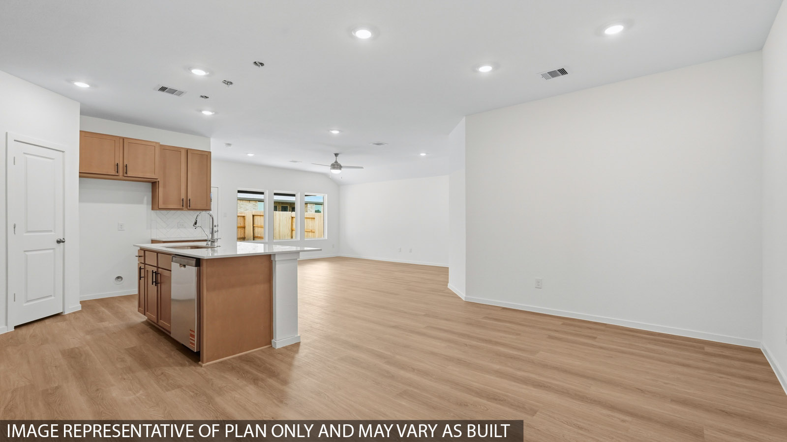 open concept living and dining area with vinyl flooring and large windows