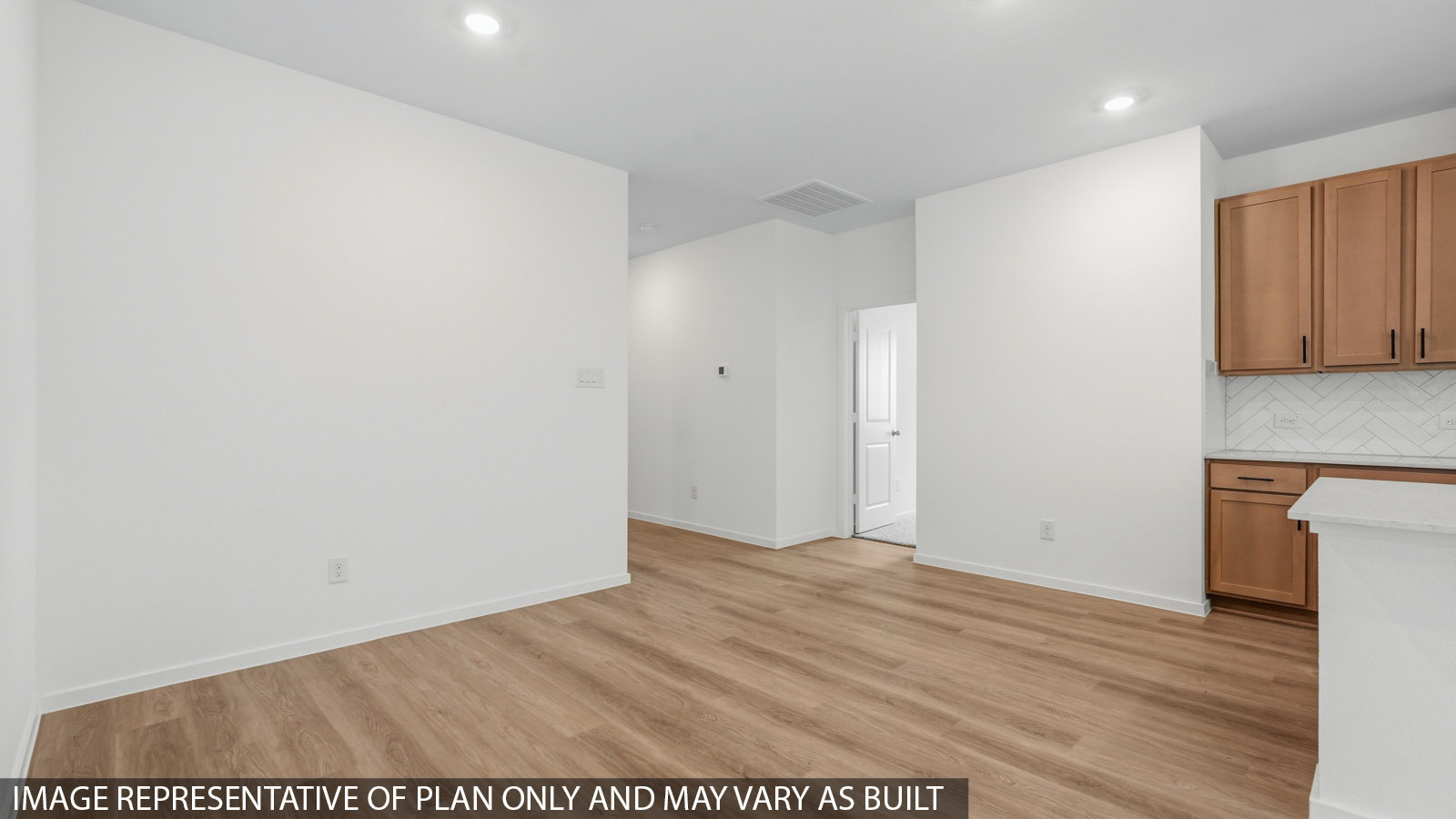 open concept living and dining area with vinyl flooring and large windows