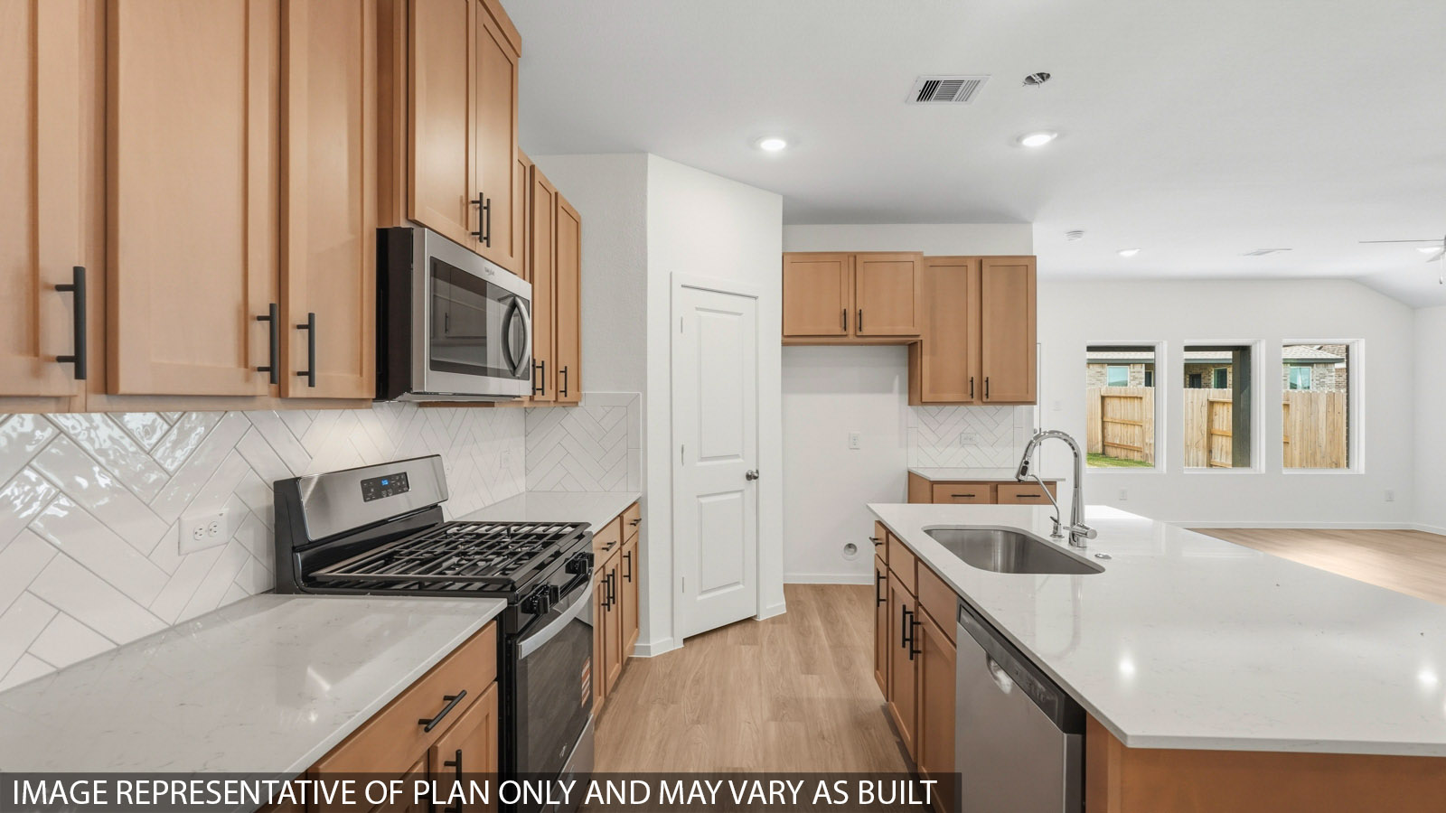 open concept living and dining area with vinyl flooring and large windows