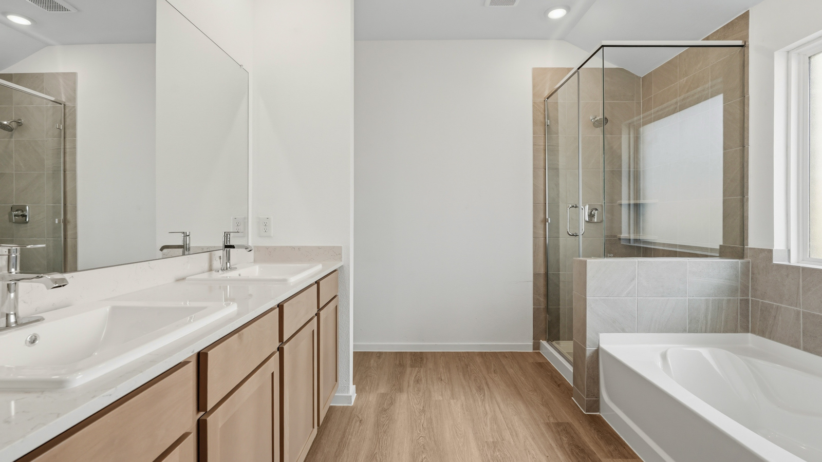 primary bathroom with separate tub and shower