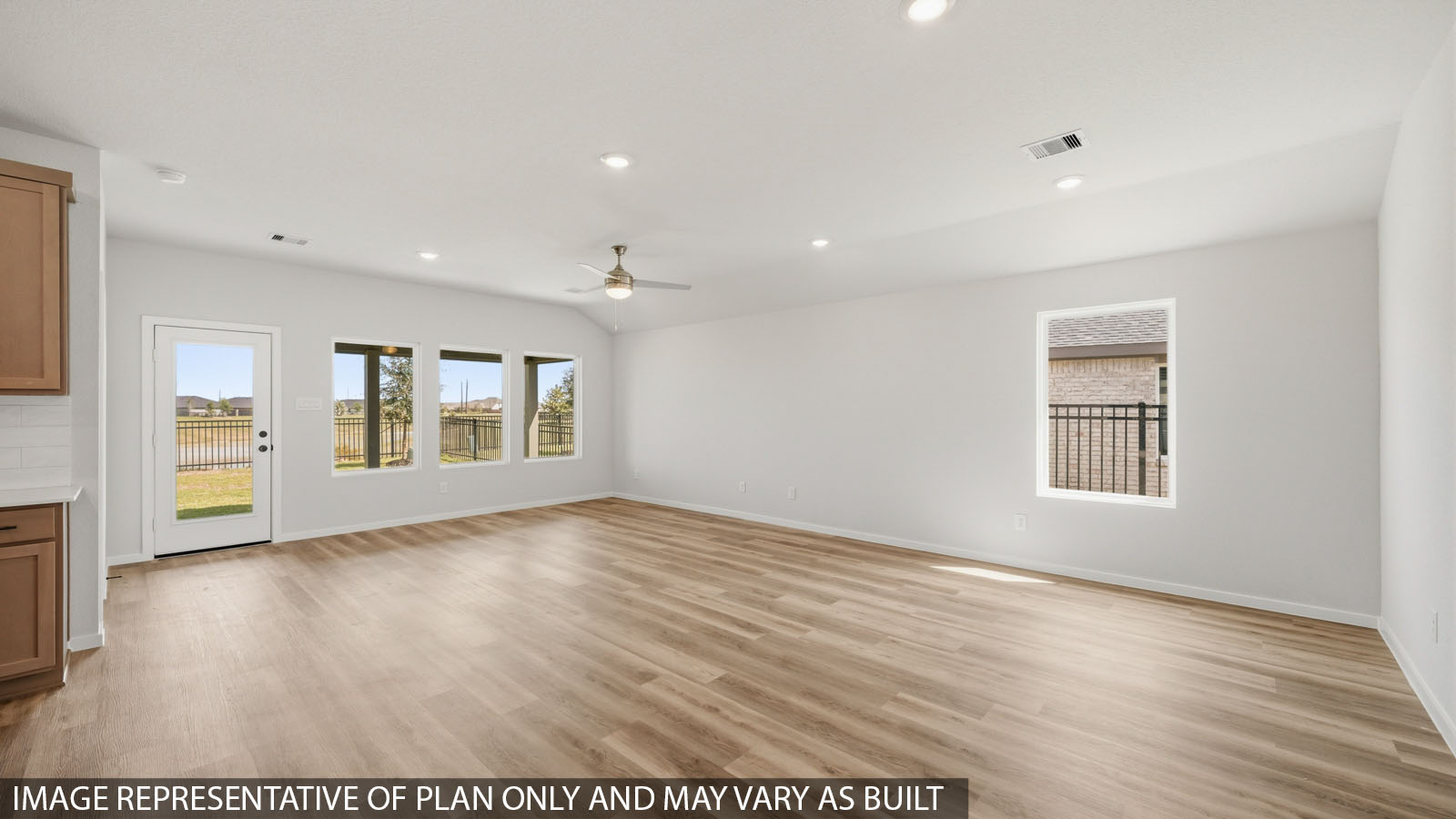 open concept living and dining area with vinyl flooring, large windows, and vinyl flooring