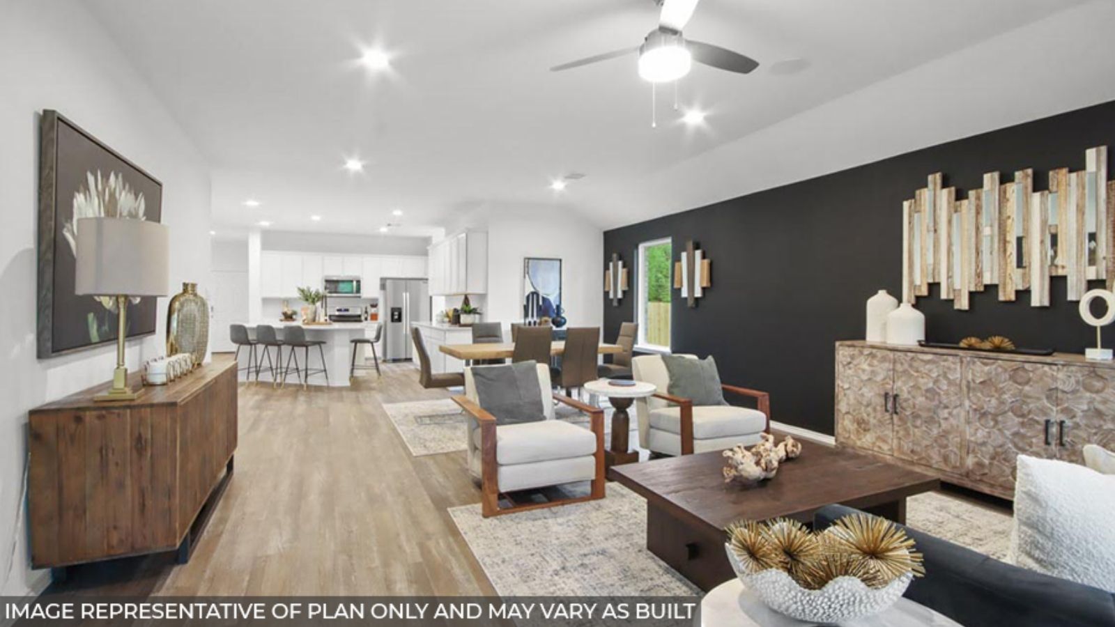 open concept living and dining area with vinyl flooring, quartz countertops, and large windows
