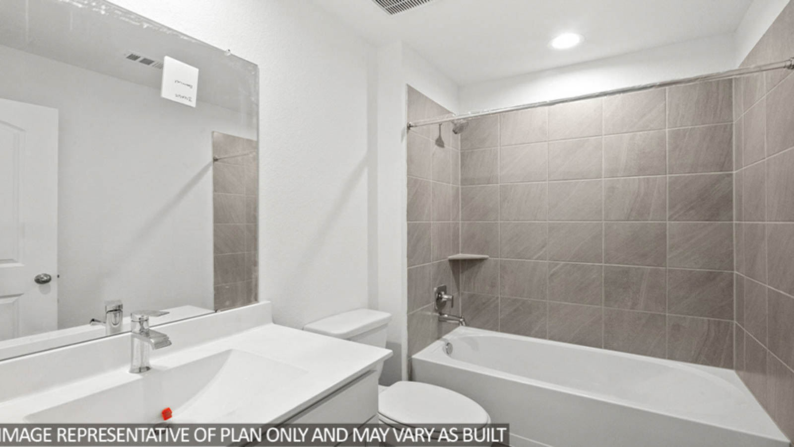 Secondary bathroom with a shower and tub combo, white walls, white cabinets, and vinyl wood flooring.
