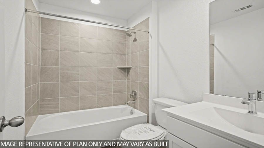 Secondary bathroom with a singular sink, shower and tub combo, white walls, and vinyl wood flooring.