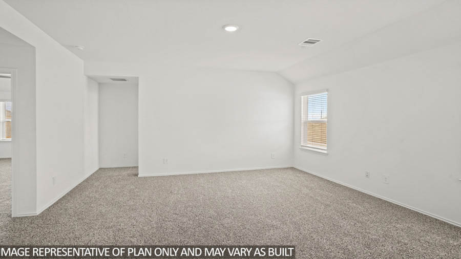 Large game room with windows, white walls, and light carpet.