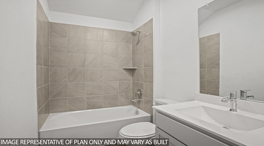 Secondary bathroom with tub/shower combo.