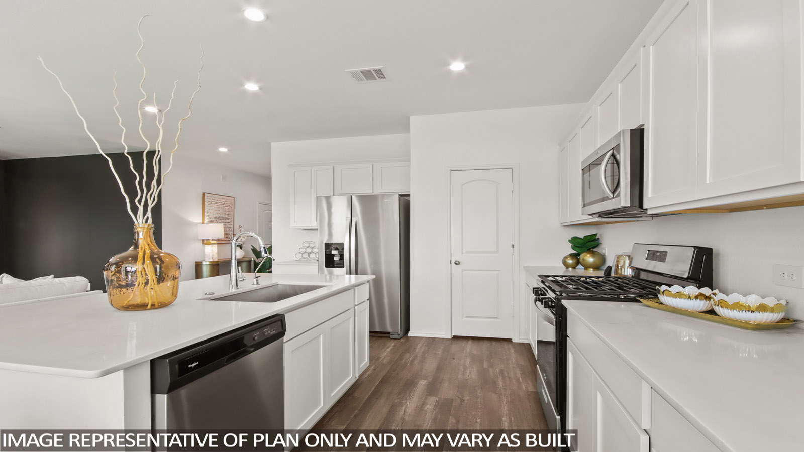 Kitchen featuring white cabinets, stainless steel appliances, and a large island.