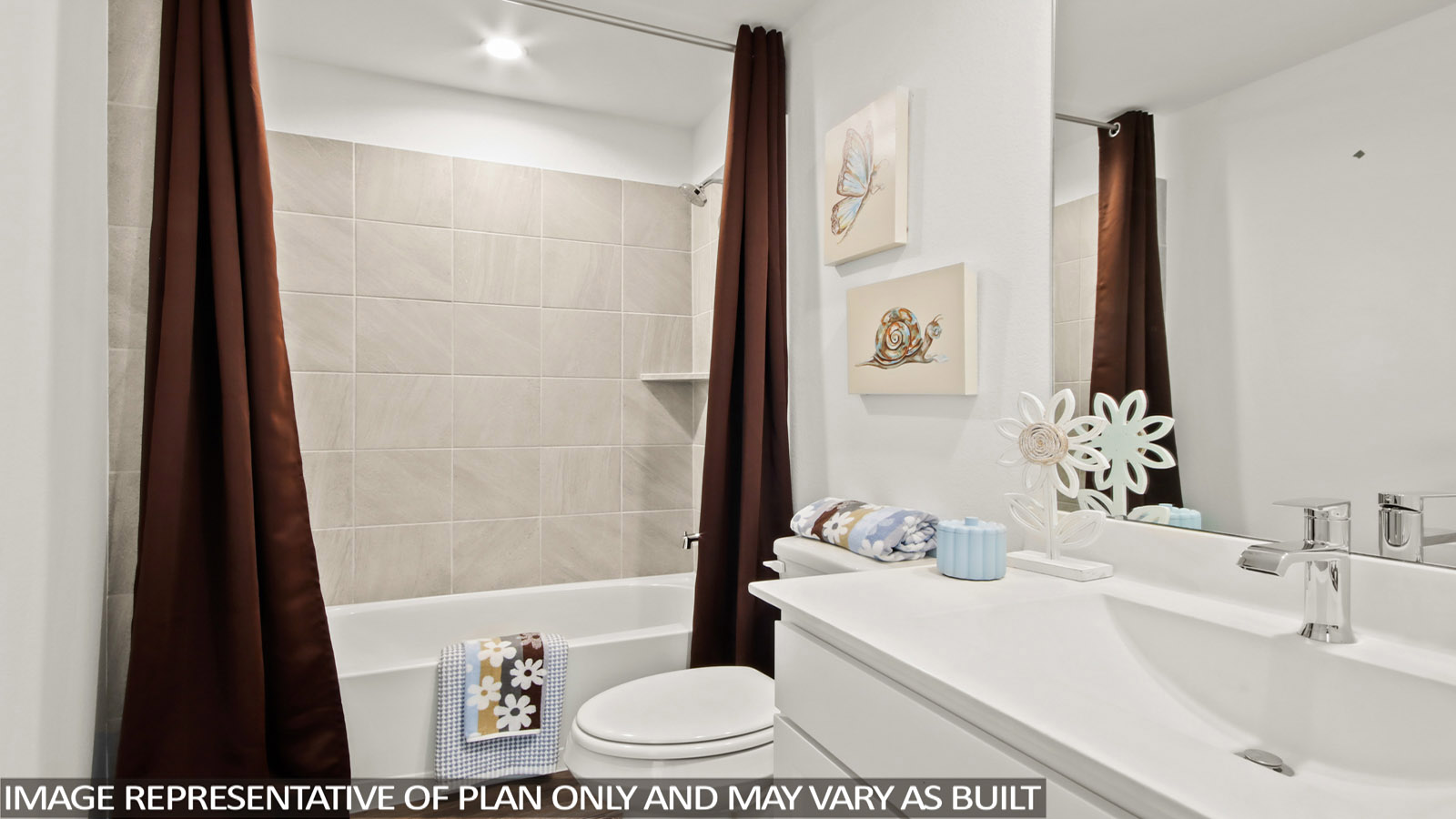 Bathroom with a sink, toilet, and shower tub.