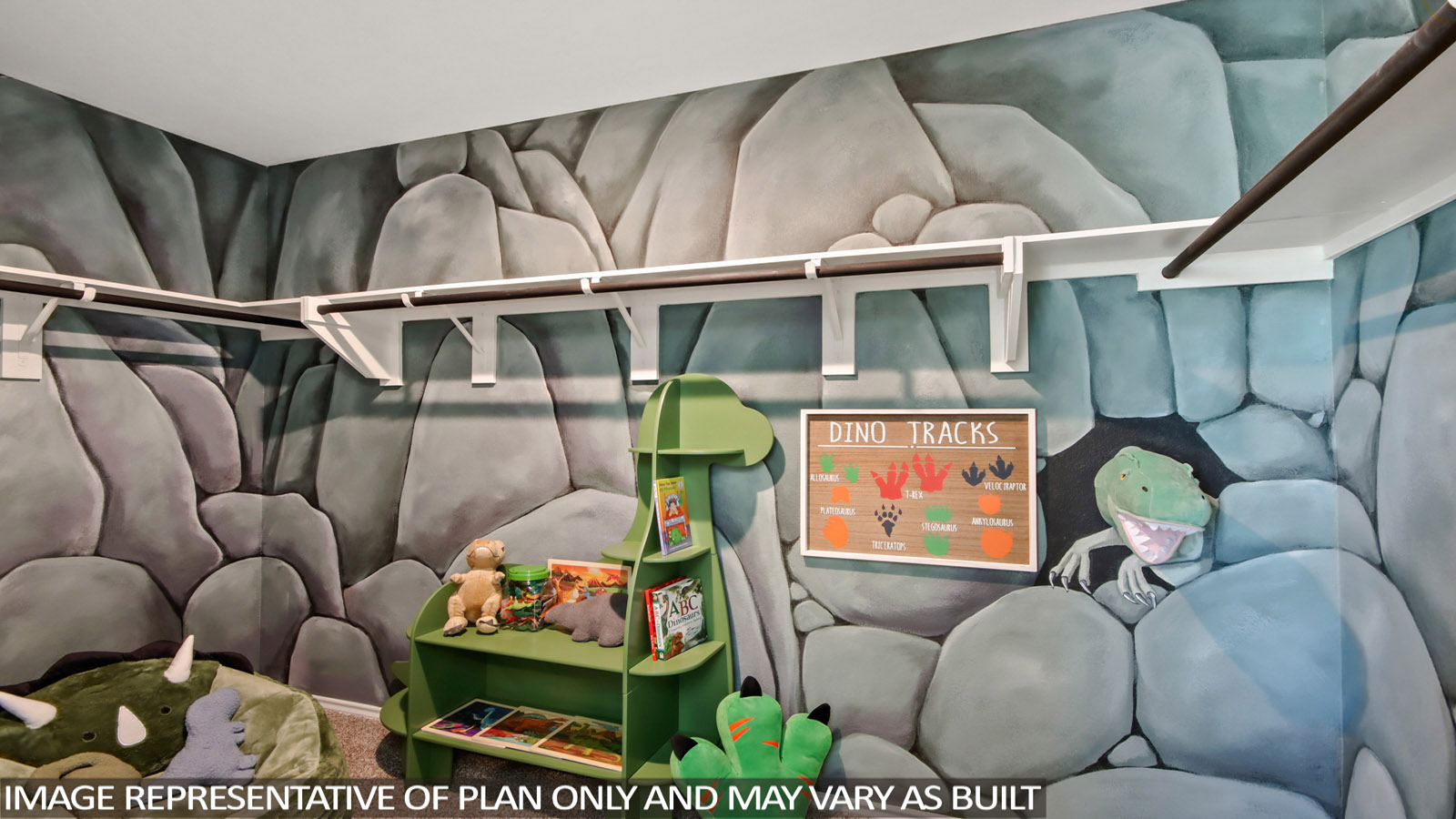 A large walk in closet that is dinosaur themed.