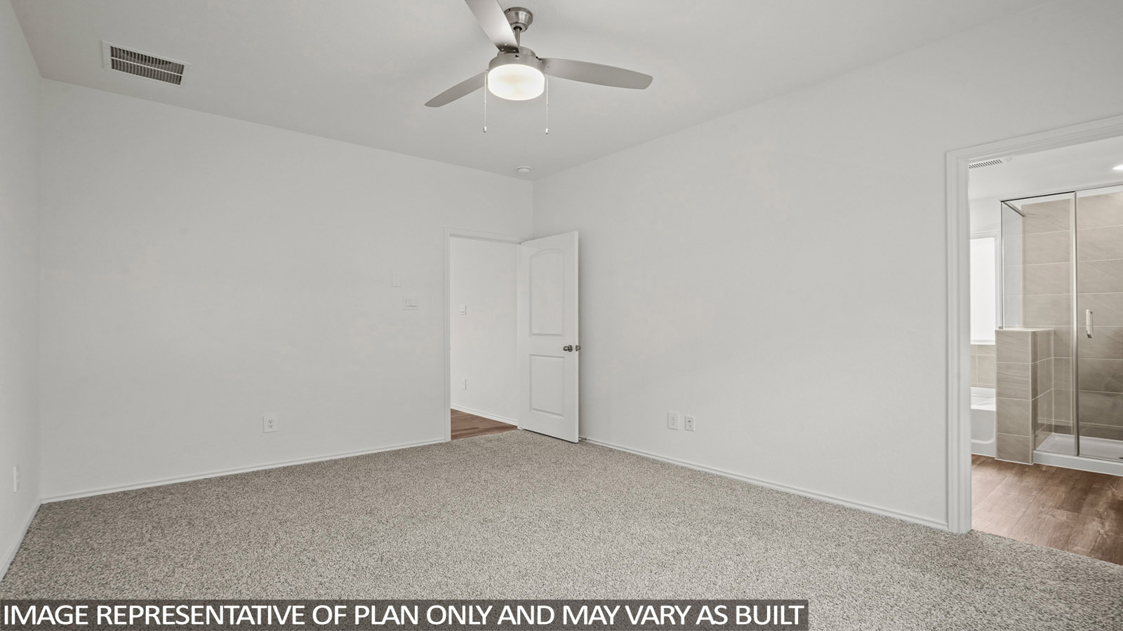Primary bedroom with carpet flooring