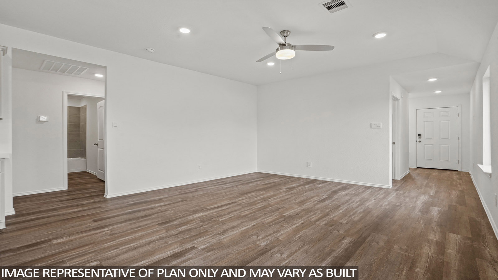 open concept living and dining area with quartz countertops, and stainless steel appliances