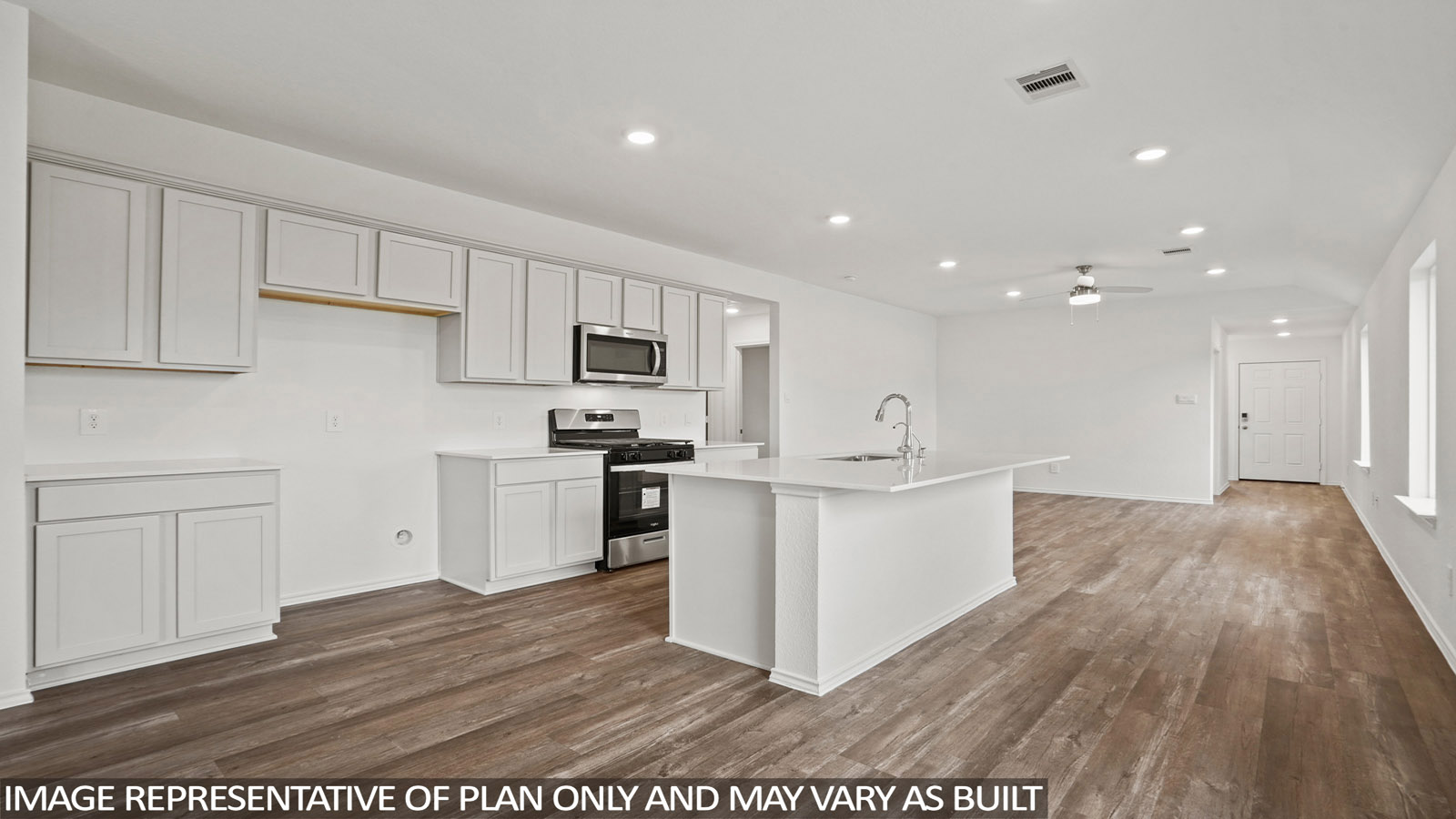 open concept living and dining area with quartz countertops, and stainless steel appliances