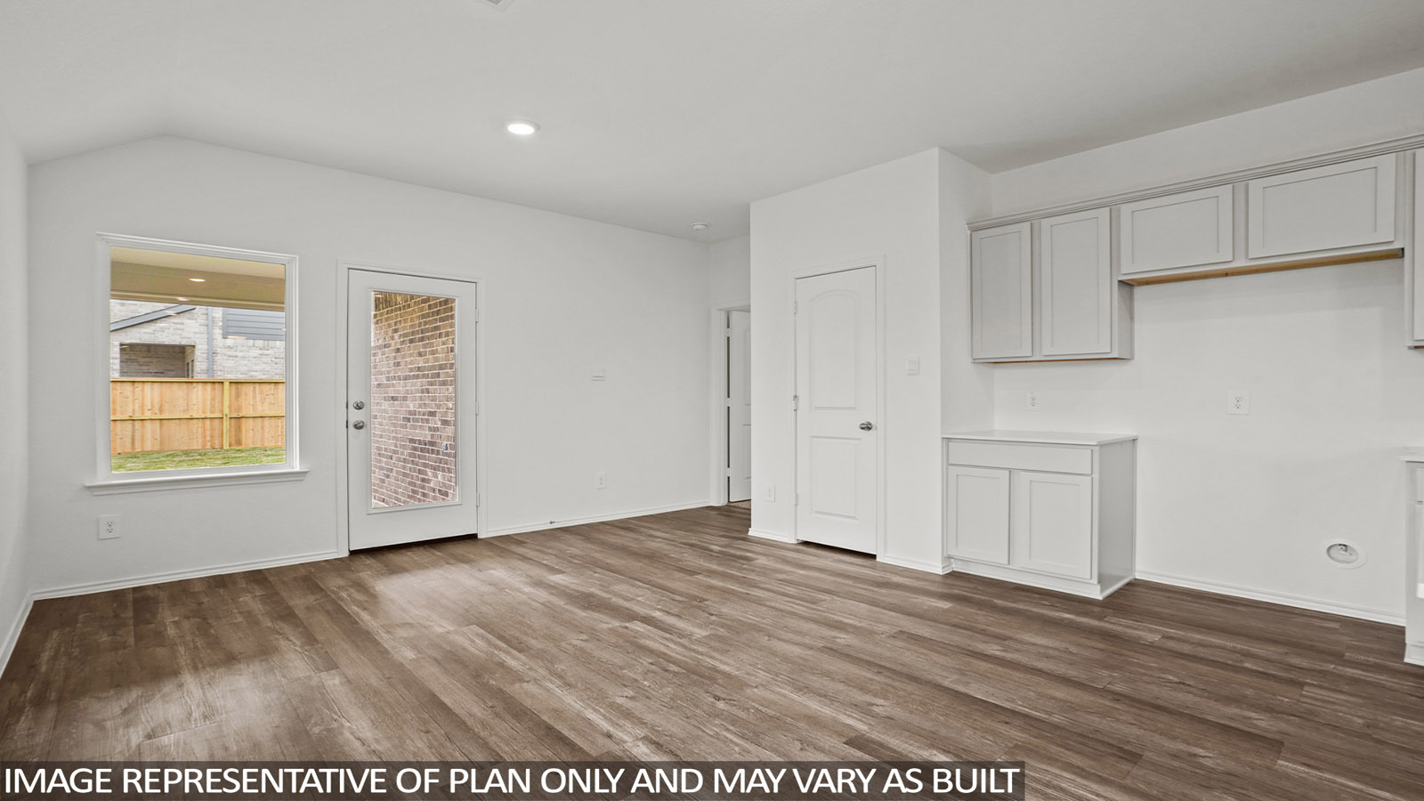 open concept living and dining area with quartz countertops, and stainless steel appliances