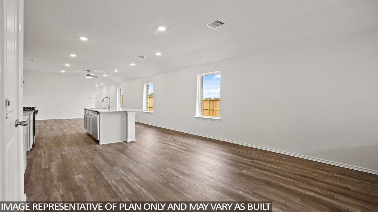 open concept living and dining area with quartz countertops, and stainless steel appliances
