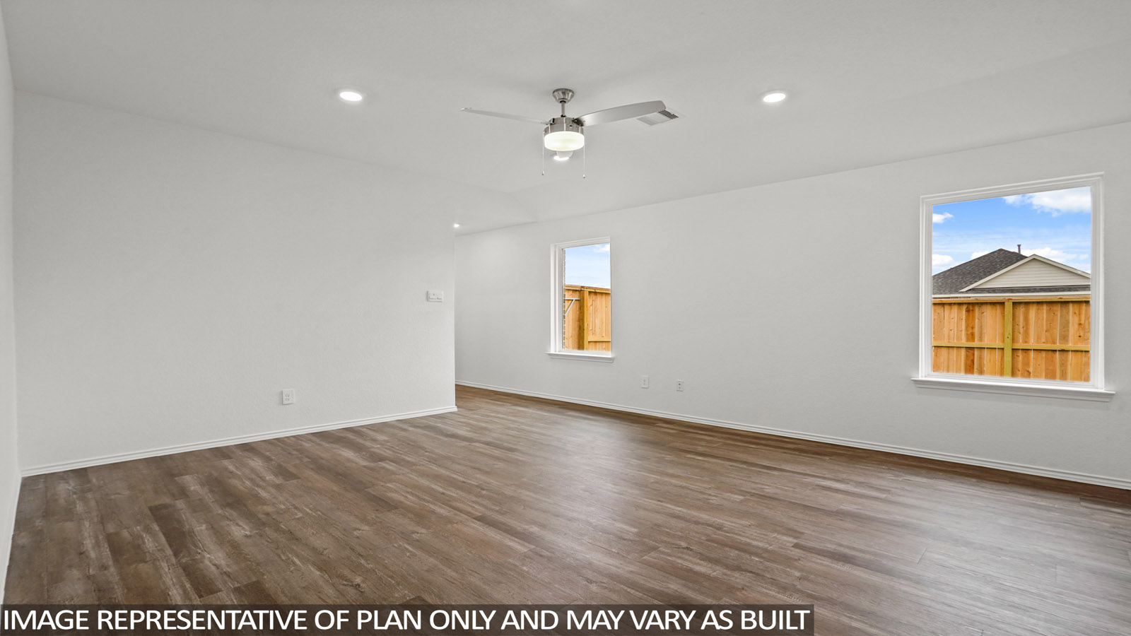 open concept living and dining area with quartz countertops, and stainless steel appliances
