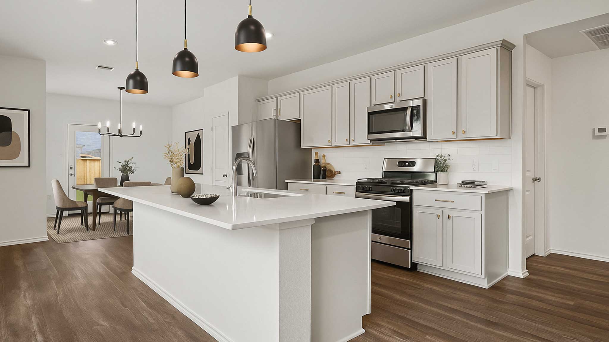 open concpt living and dining area with vinyl  flooring, quartz countertops, and large windows