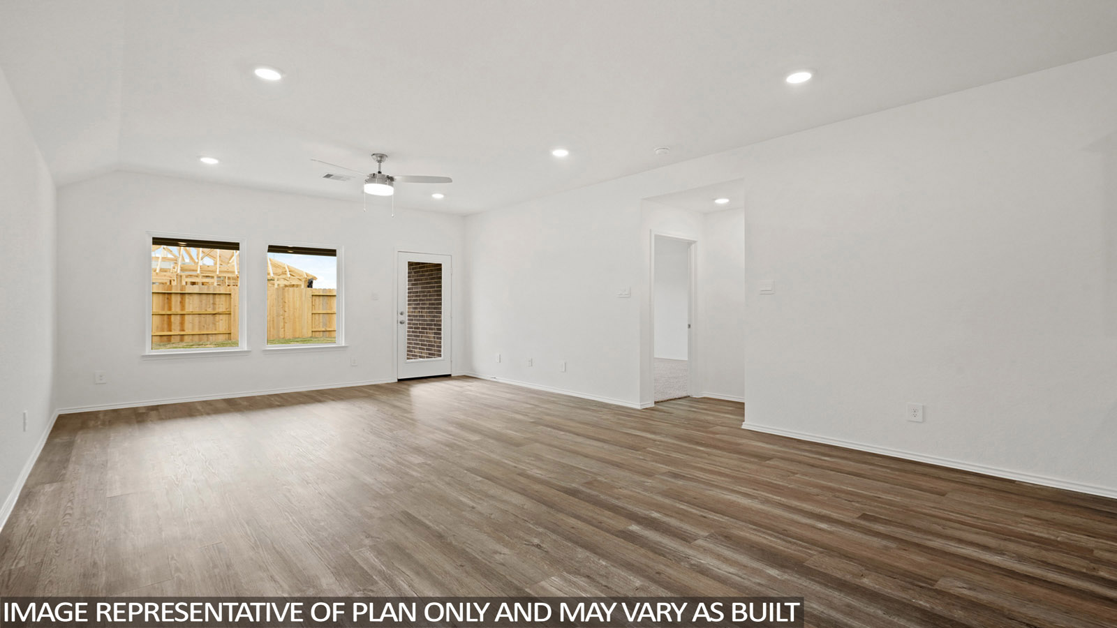 open concept living and ding area with vinyl flooring and large windows