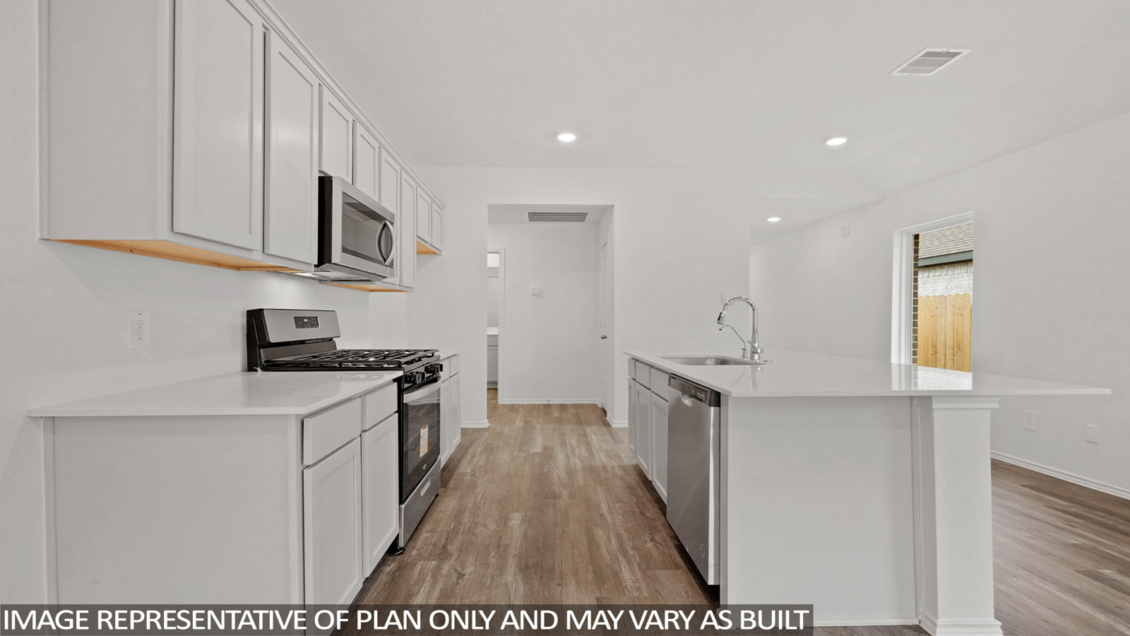 Open concept living and dining area with vinyl flooring, quartz countertops, and stainless steel appliances