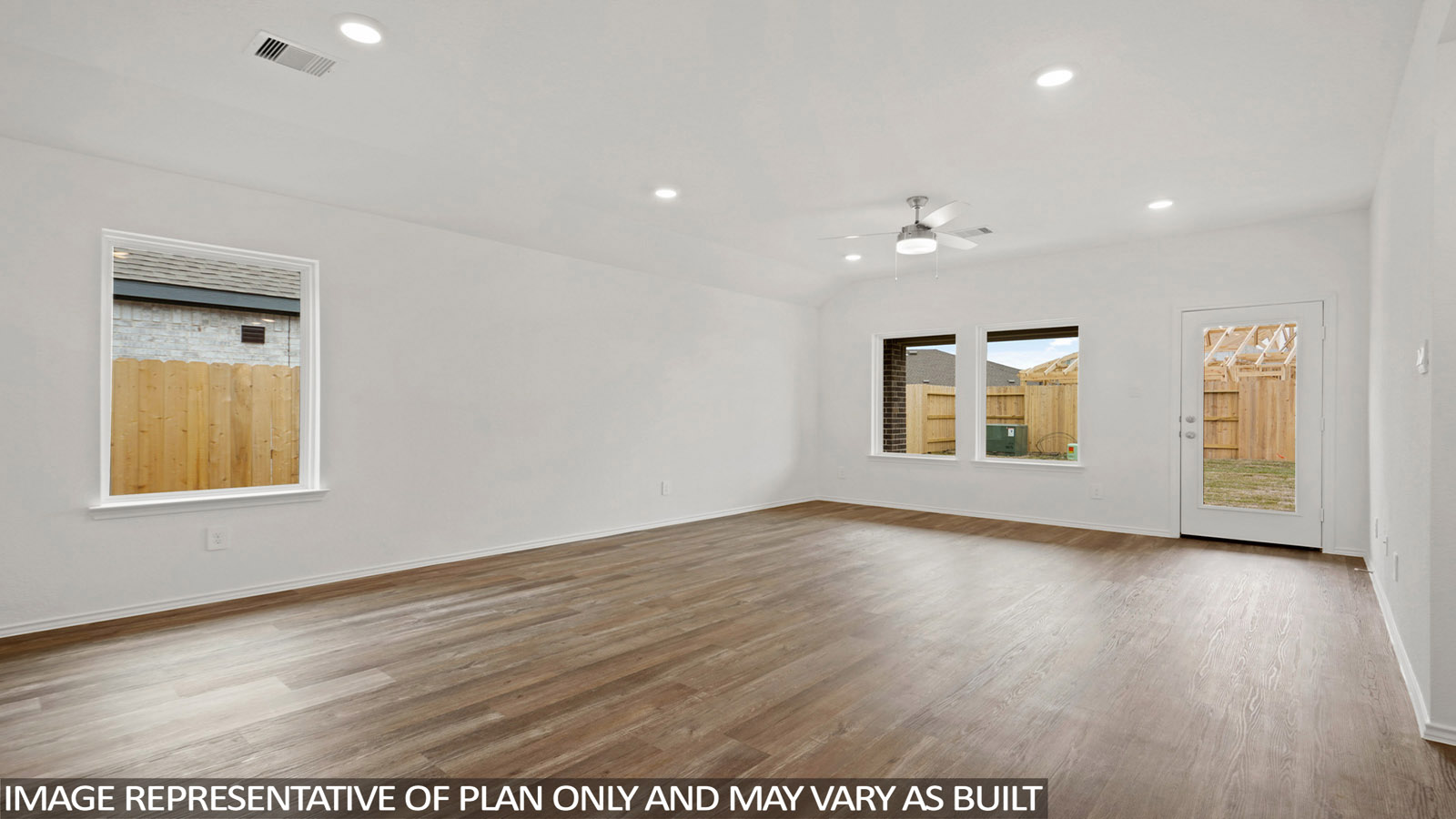 open concept living and dining area with vinyl flooring and large windows