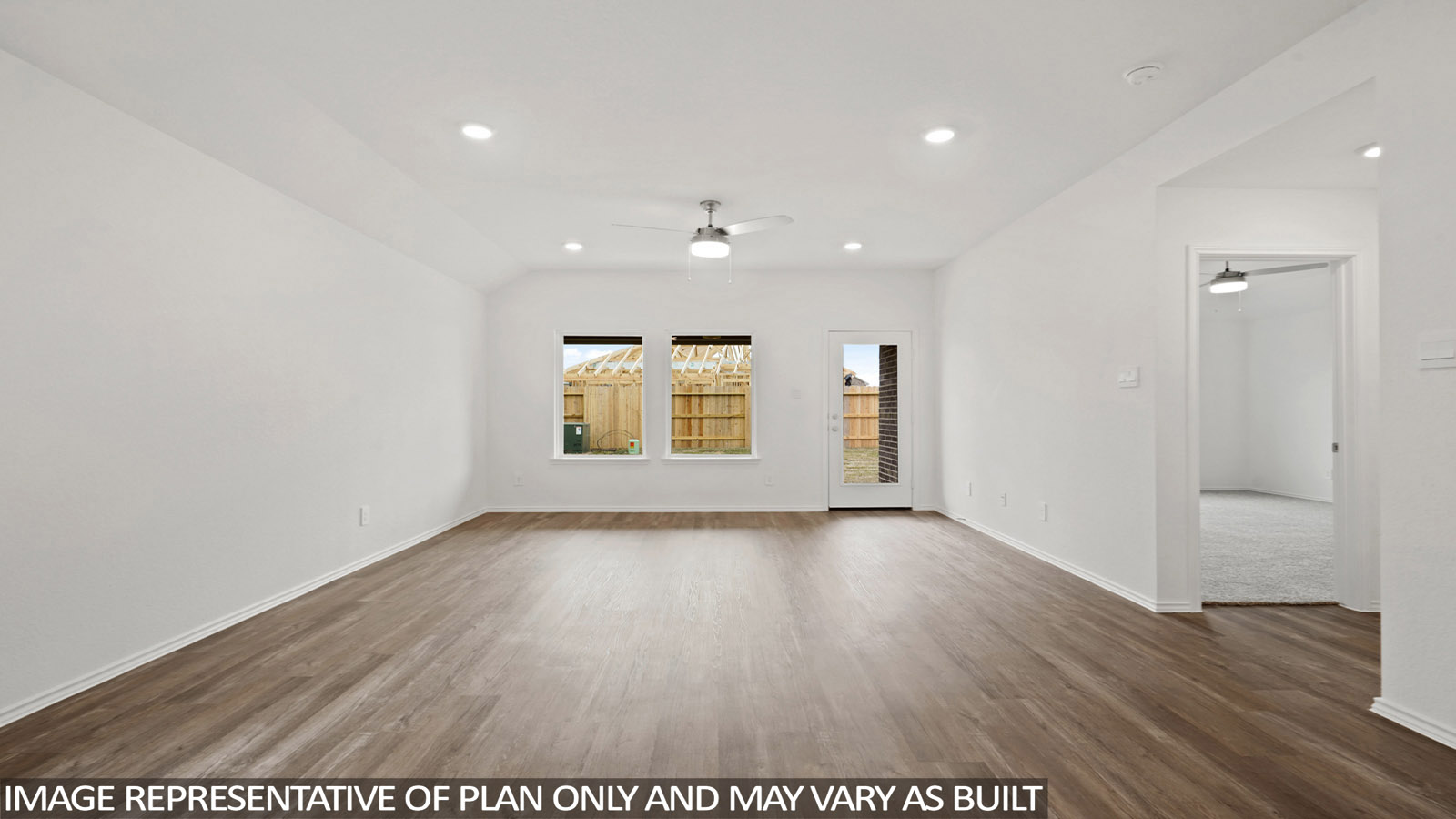 open concept living and dining area with vinyl flooring and large windows