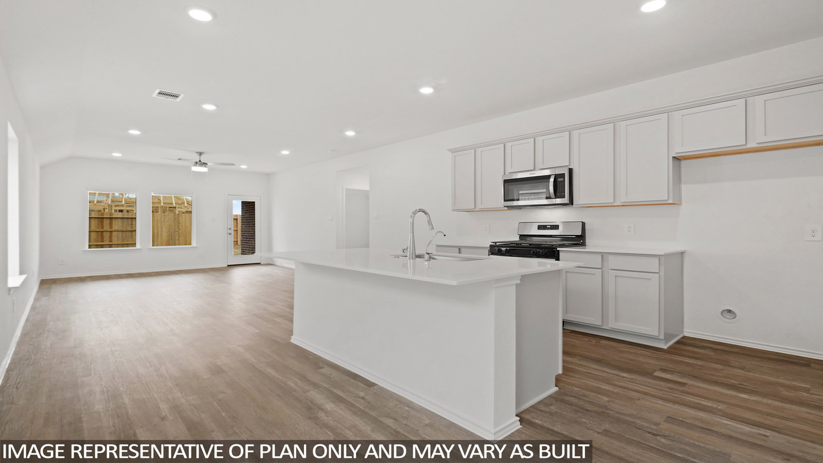open concept living and dining area with vinyl flooring and quartz countertops