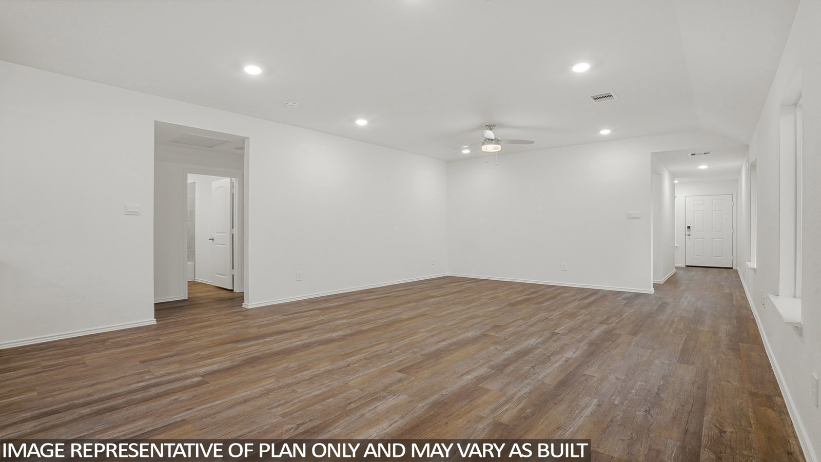 Spacious living area with vinyl flooring