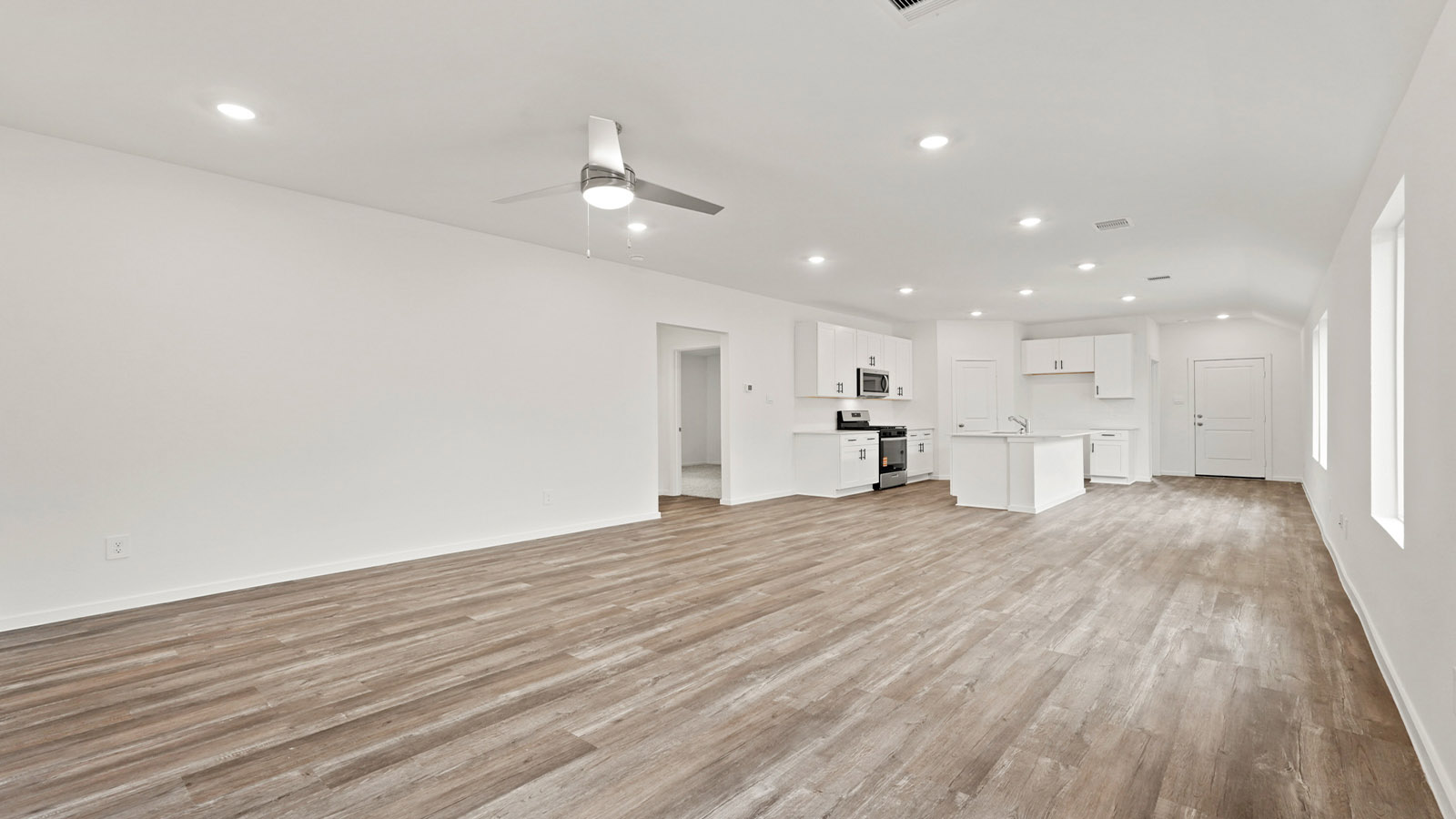 Open concept living, dining, and kitchen area