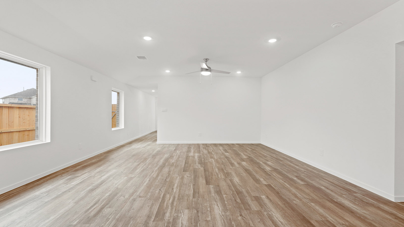 Open concept living, dining, and kitchen area