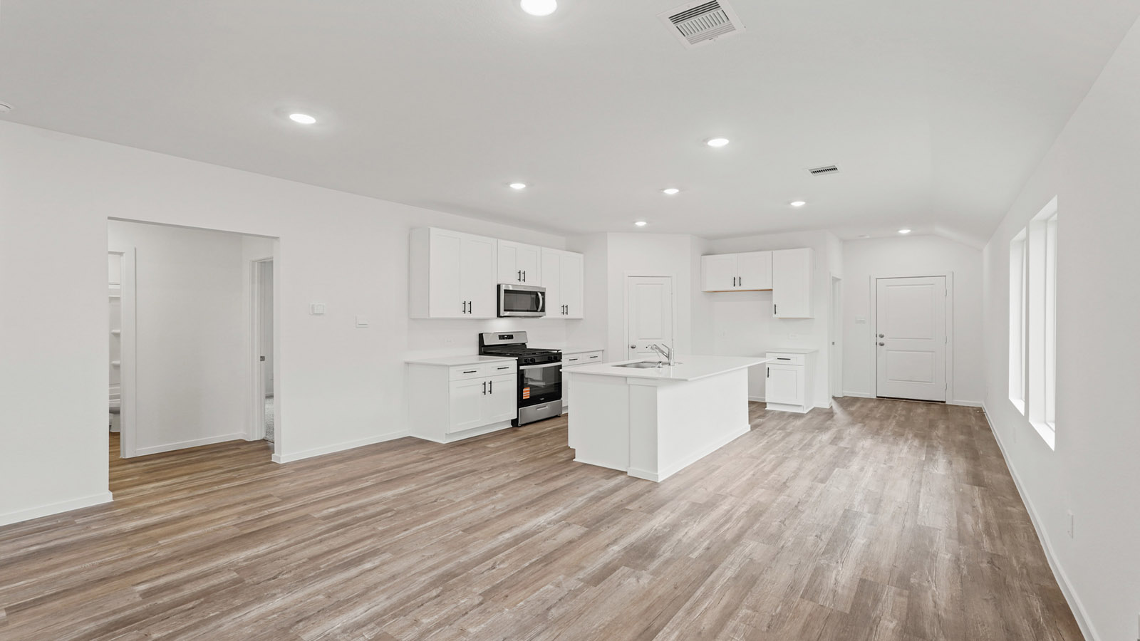 Open concept living, dining, and kitchen area