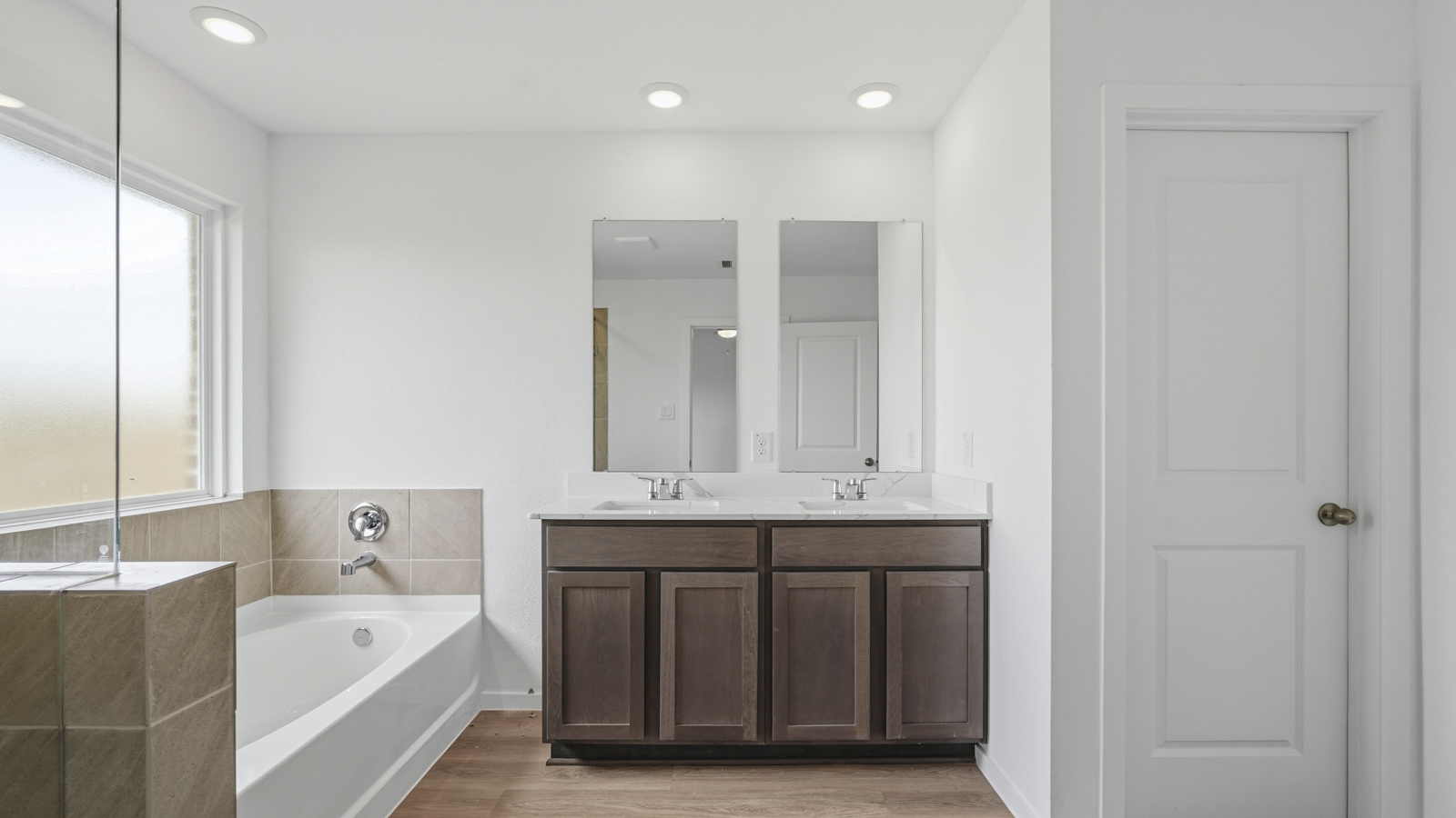 primary bathroom with seperate tub and shower in Katy, TX