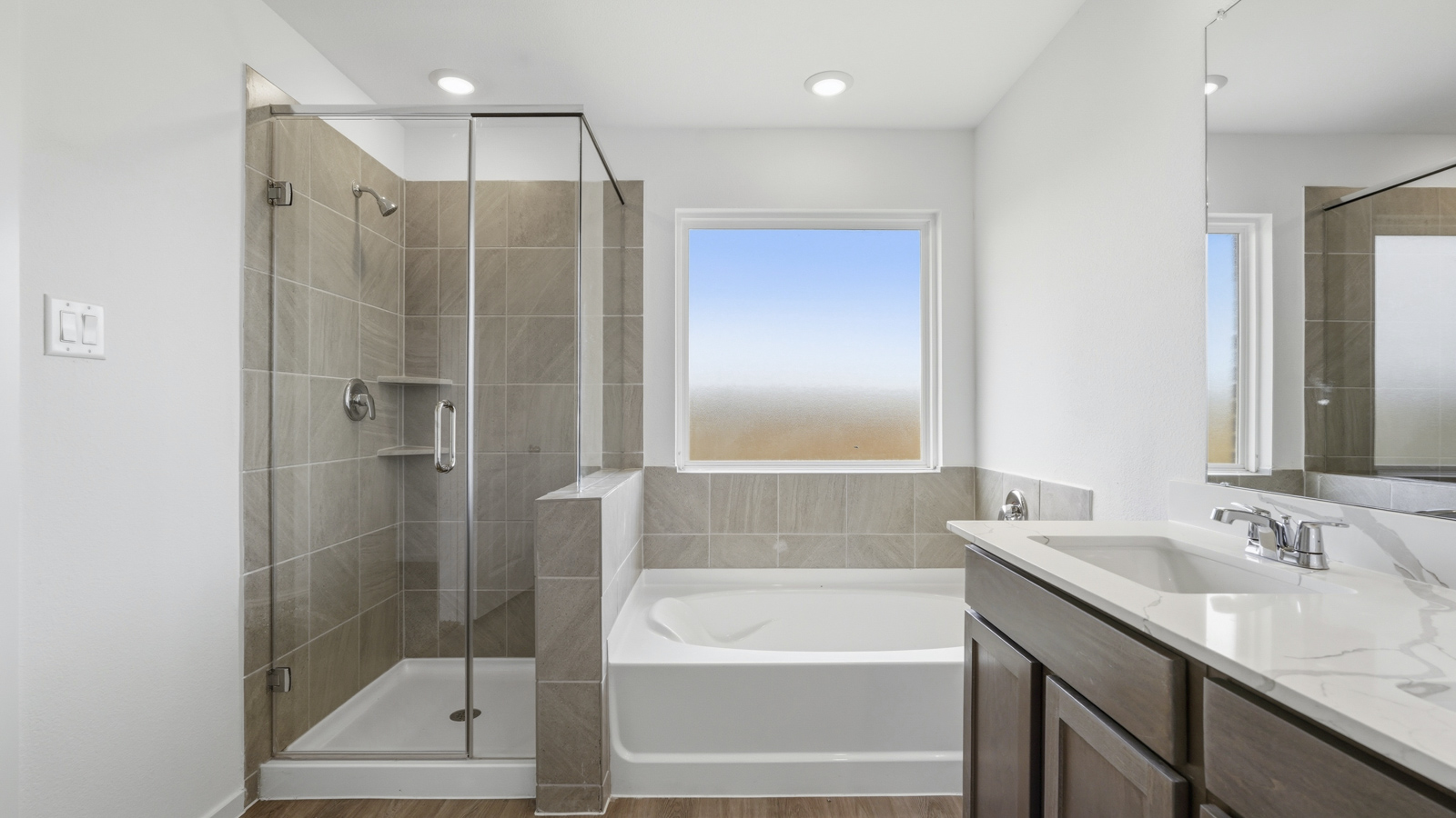 primary bathroom with seperate tub and shower in Katy, TX