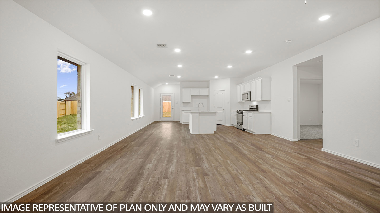 open concept living and dining area with vinyl flooring, quartz countertops, and stainless steel appliances in Katy, Tx