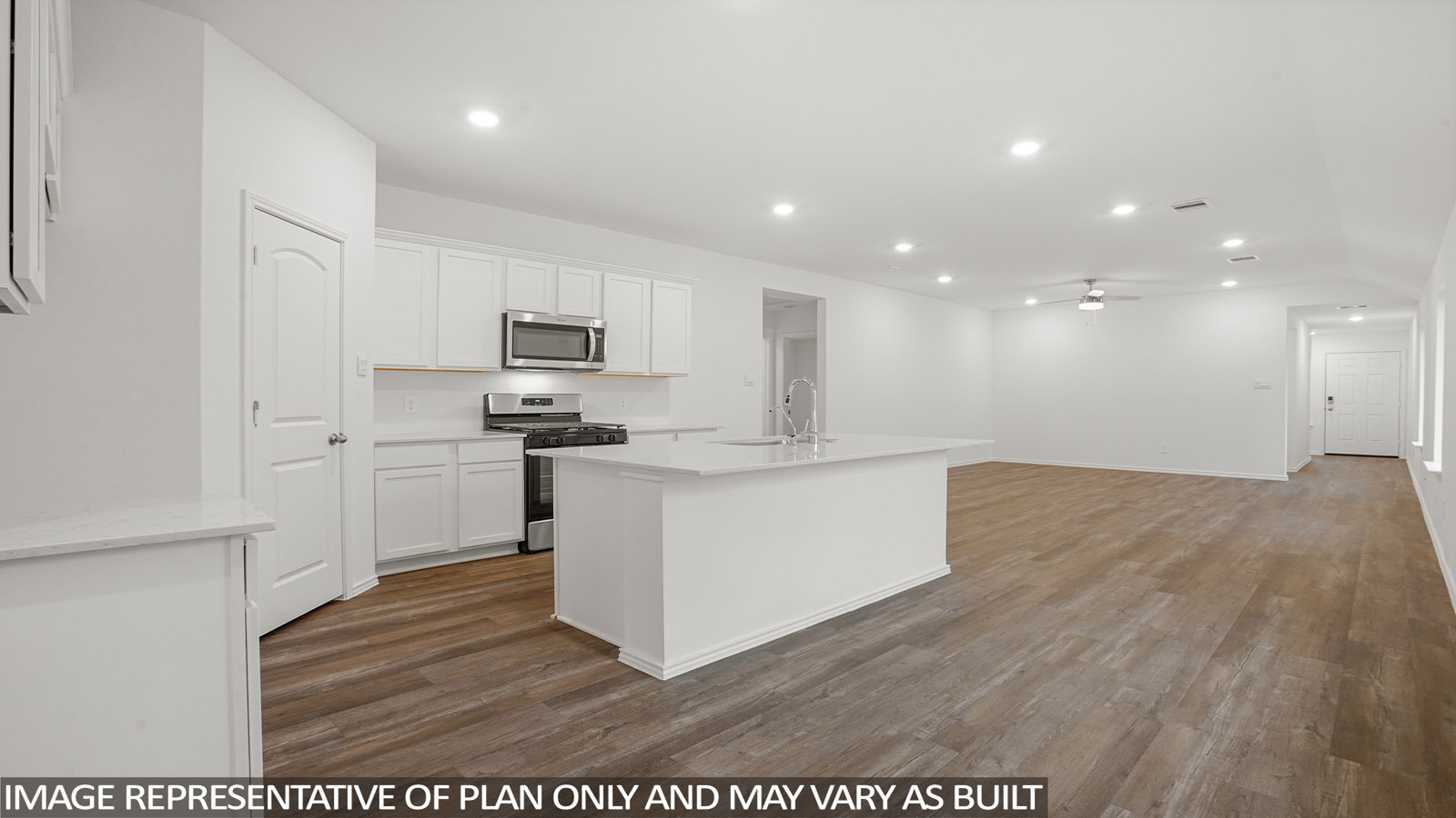 open concept living and dining area with vinyl flooring, large windows, and quartz countertops in Katy, TX