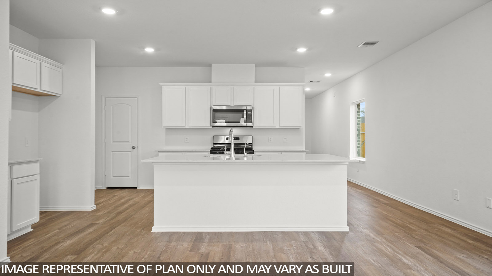 open concept livivng and dining area with vinyl flooring, quartz countertops, and large windows