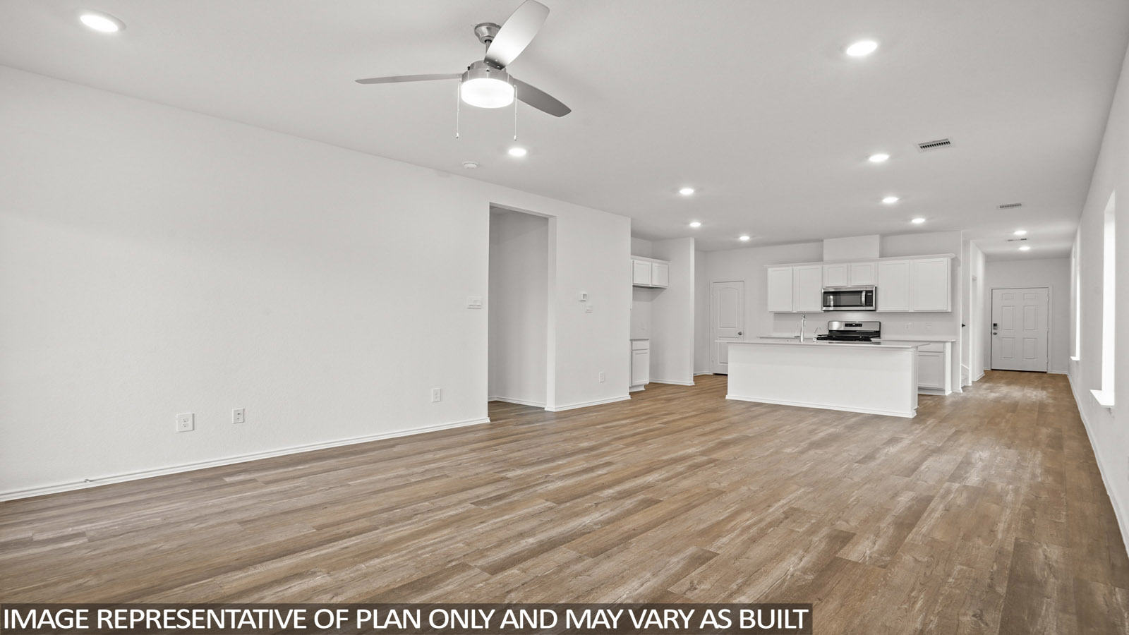 open concept living and dining area with vinyl flooring, large windows, and quartz countertops