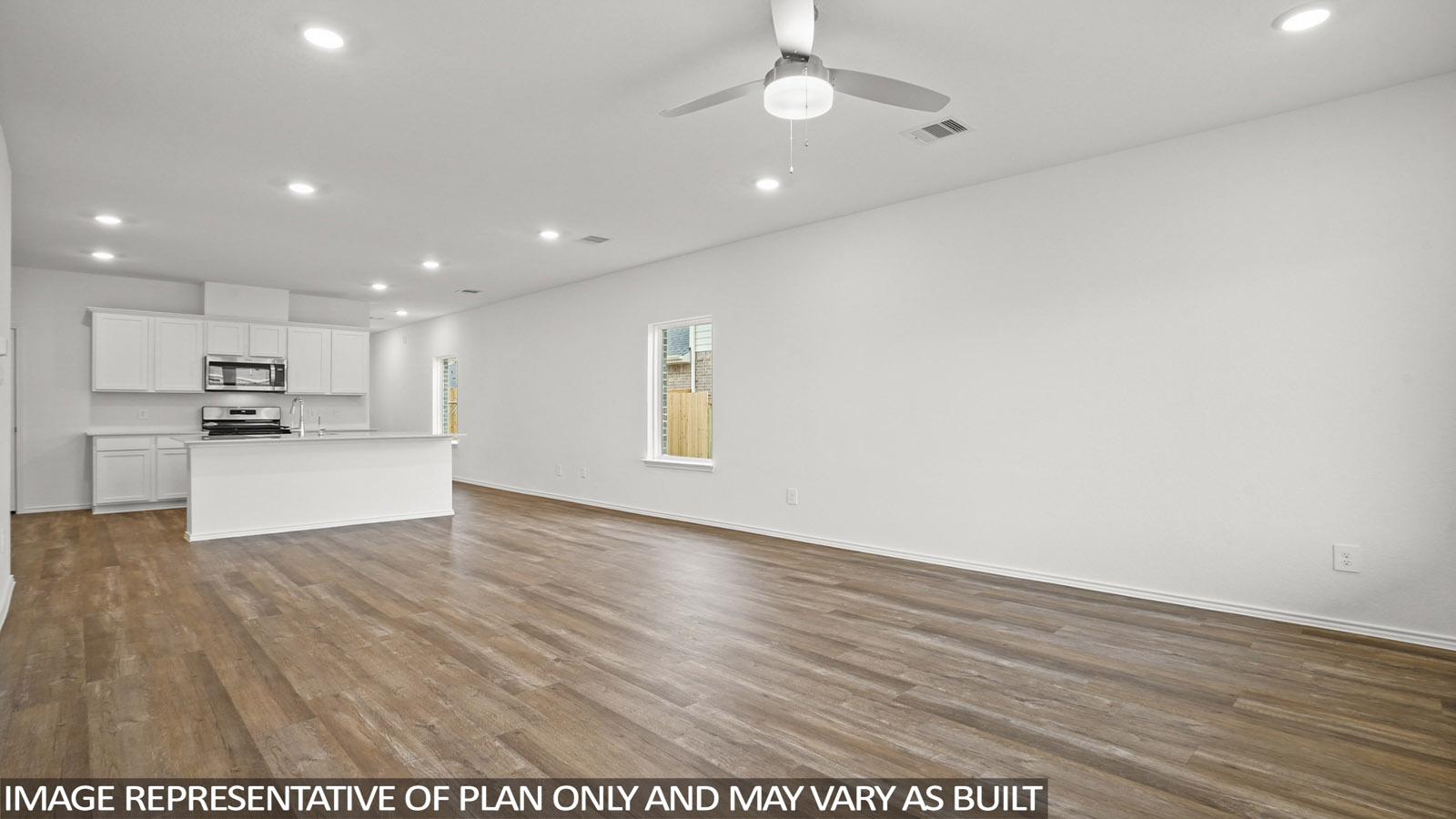 open concept living and dining area with vinyl flooring, large windows, and quartz countertops