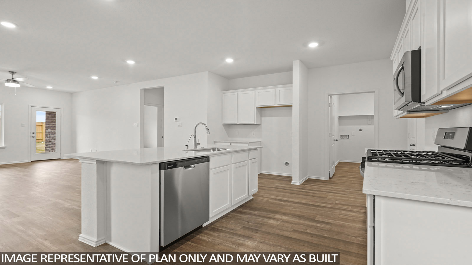 open concept living and dining area with vinyl flooring, large windows, and quartz countertops