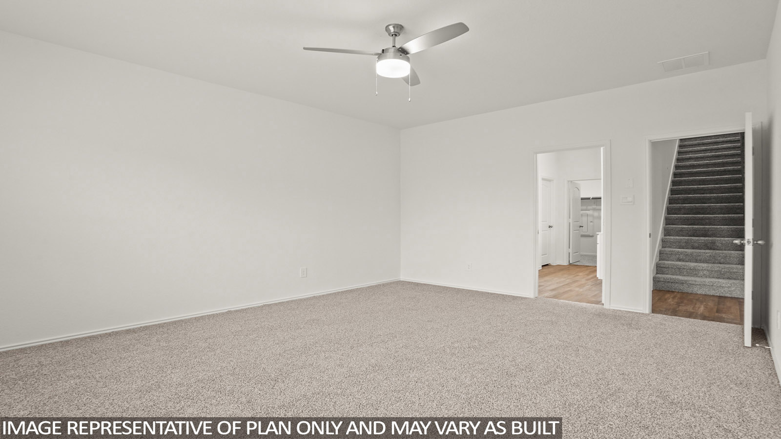 Primary bedroom with carpet flooring