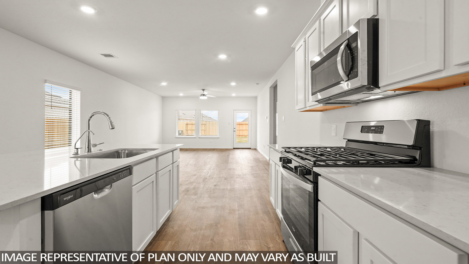 open concept living and dining area with vinyl flooring
