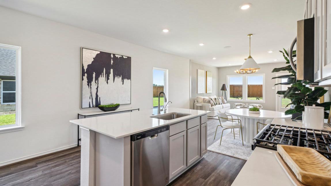 open concept living and dining area with vinyl flooring and large windows