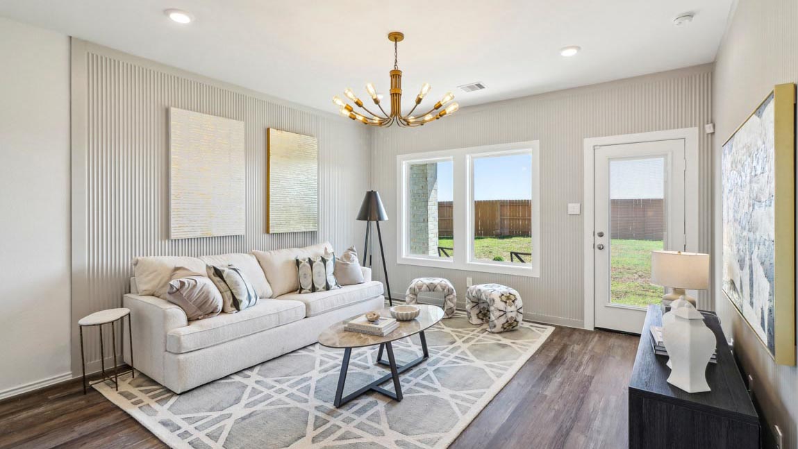 open concept living and dining area with vinyl flooring and large windows