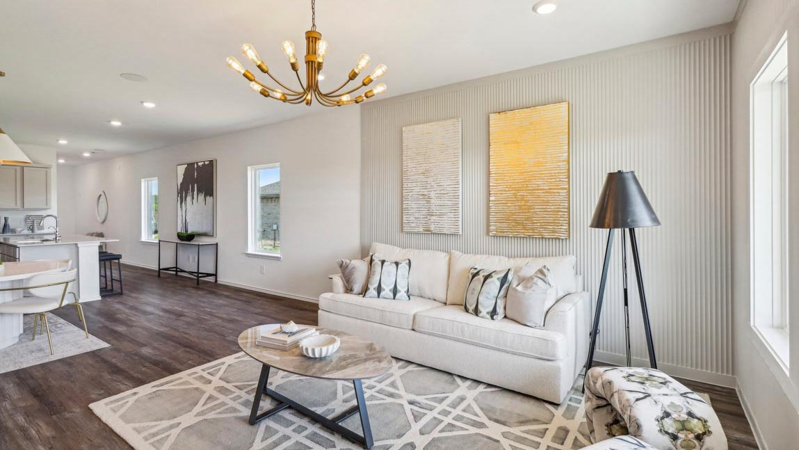 open concept living and dining area with vinyl flooring and large windows