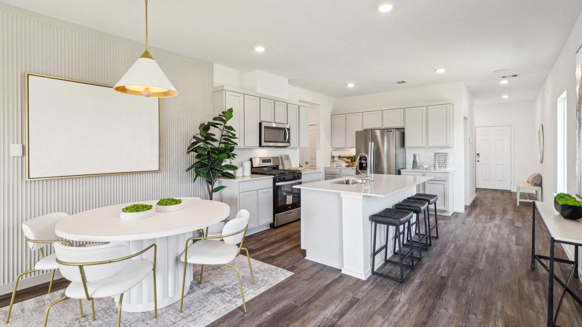 open concept living and dining area with vinyl flooring and large windows