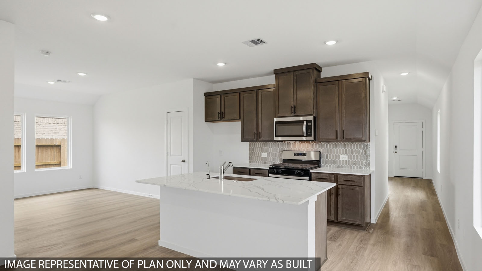 open concept living and dining area with vinyl flooring with quartz countertops