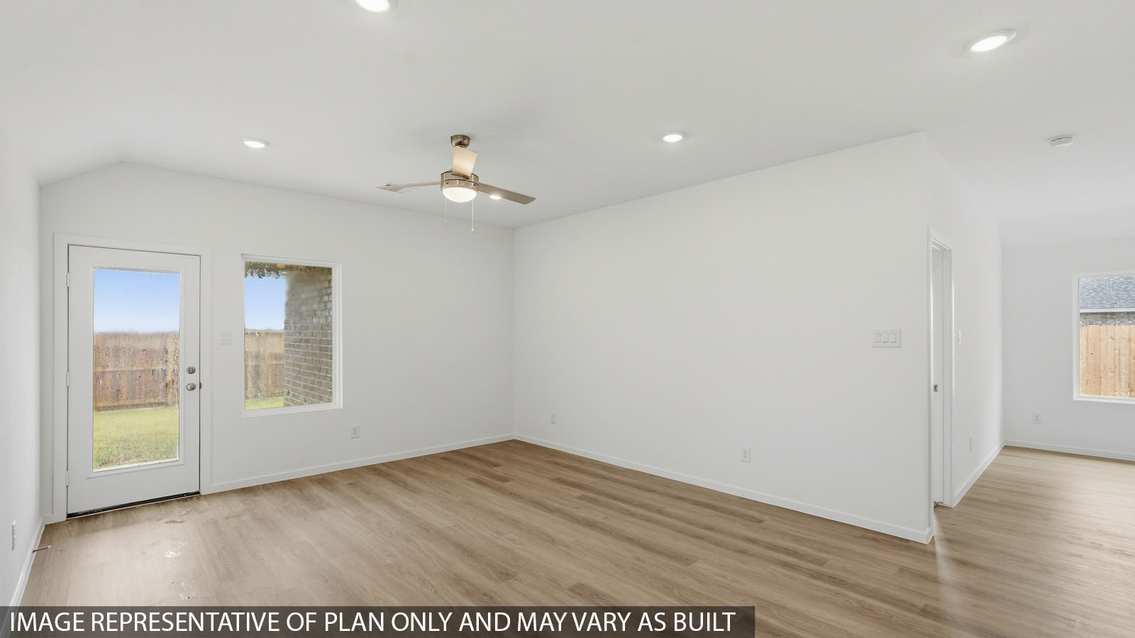 open concept living and dining area with vinyl flooring with quartz countertops