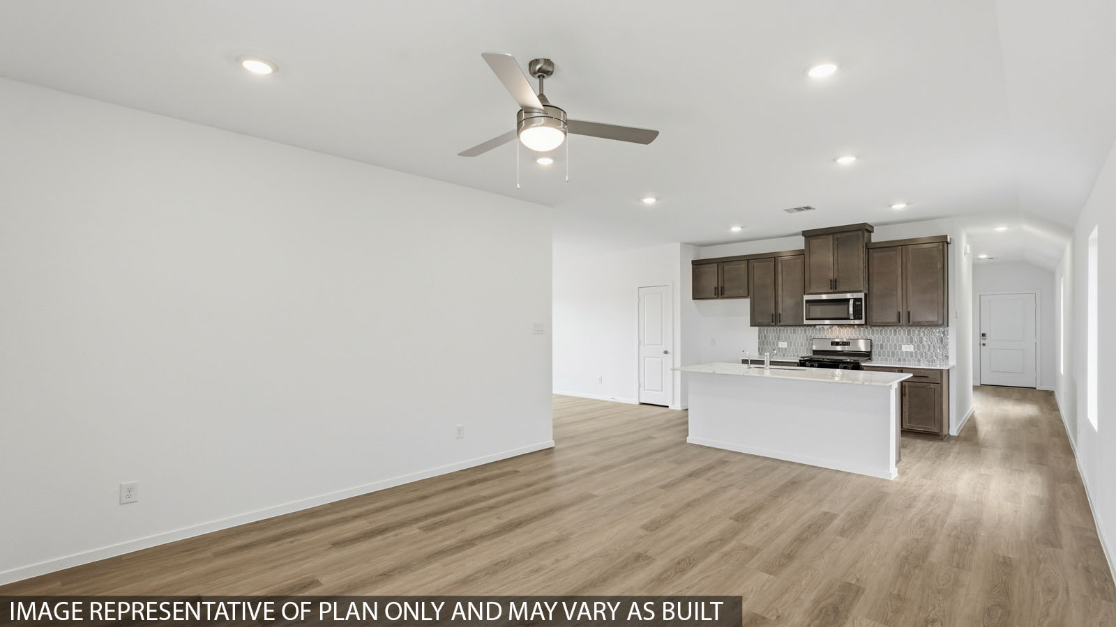 open concept living and dining area with vinyl flooring with quartz countertops